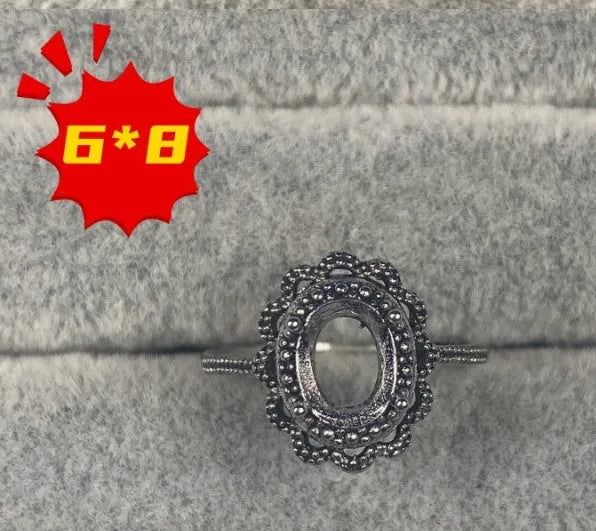 Oval denier open mouth ring with 6x8mm stone and five-pointed star on electroplated copper band.