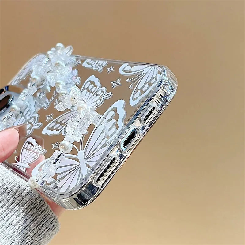 Transparent iPhone 15 Pro Max case with integrated mirror and bow decoration on back