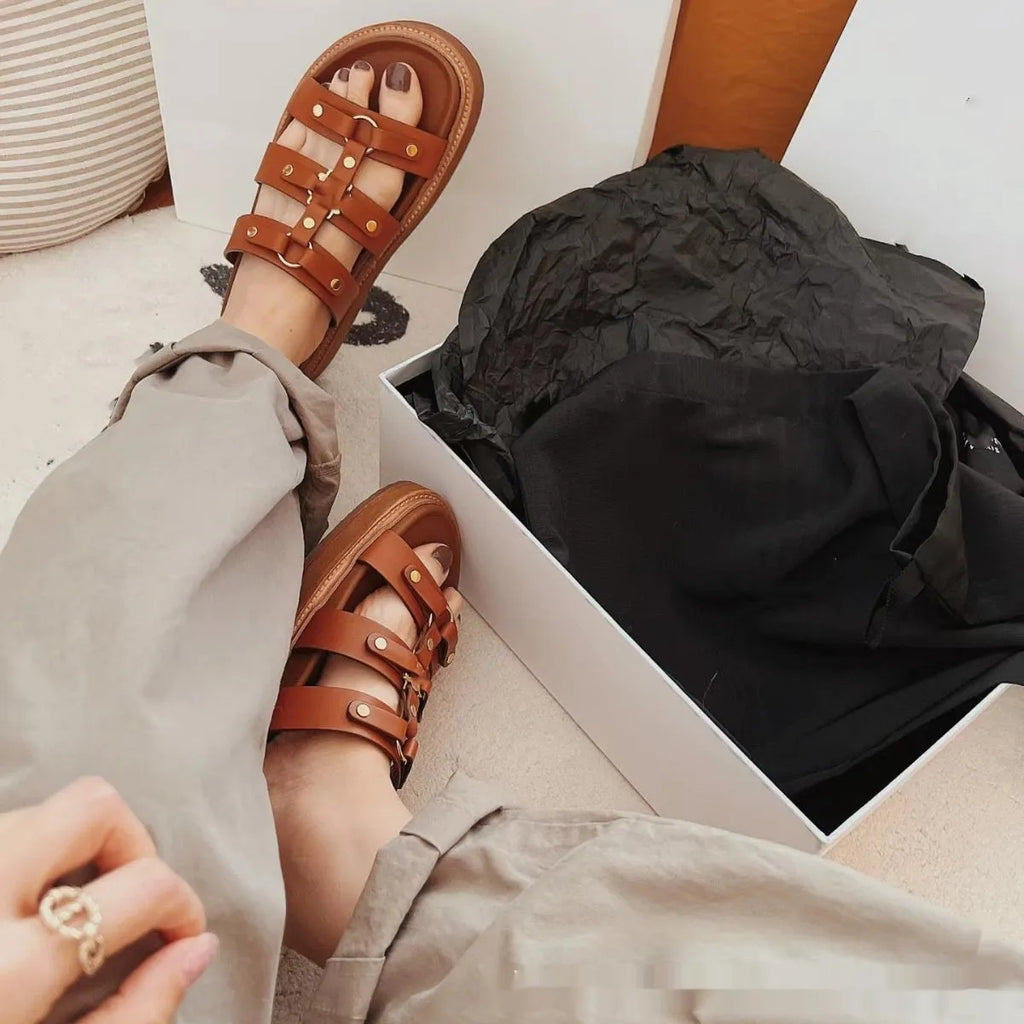 Women's white Roman-style sandal slippers made from glossy patent leather