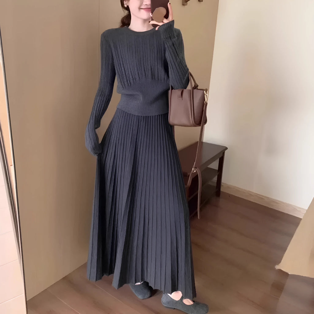 Dark grey knitted two-piece dress suit with 3D texture, featuring a sweater and skirt in artistic retro style.