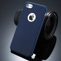 Soft plain silicone TPU phone case for iPhone in candy colours like pink, blue, and green on a table.