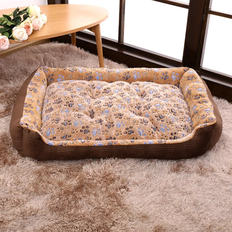 Beige sofa-style dog bed with plush fabric and raised bolsters for small dogs