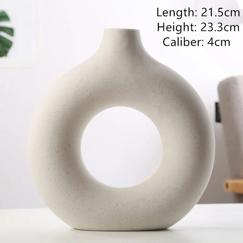 A simple modern frosted porcelain biscuit vase in a neutral colour, for flower arranging.