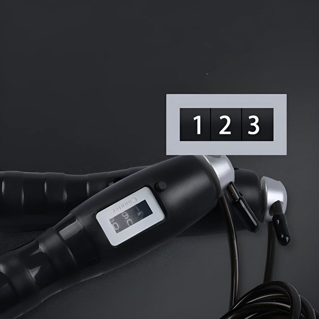 Adjustable digital skipping rope with black ABS handle and TPU coated steel cable on workout mat