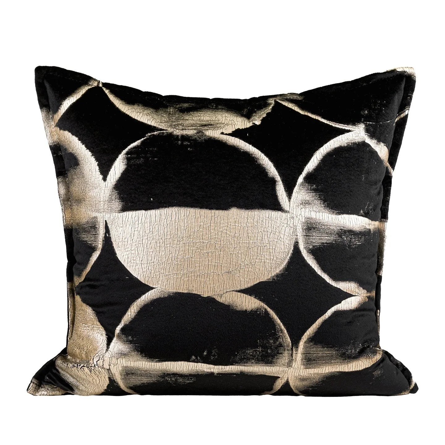 Black and gold abstract pattern decorative square and waist pillow cushions on a grey sofa.