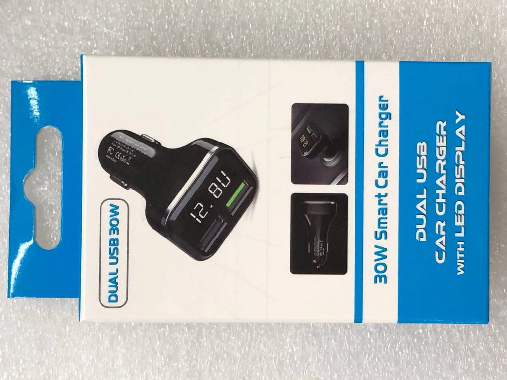 Black dual USB car charger with LCD screen displaying voltage, plugged into a car dashboard socket.