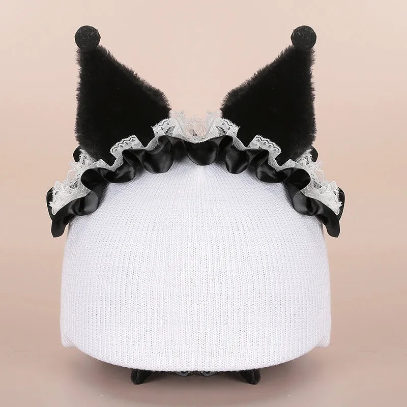 Soft plush cartoon character cover stretched over a pair of black on-ear headphones.
