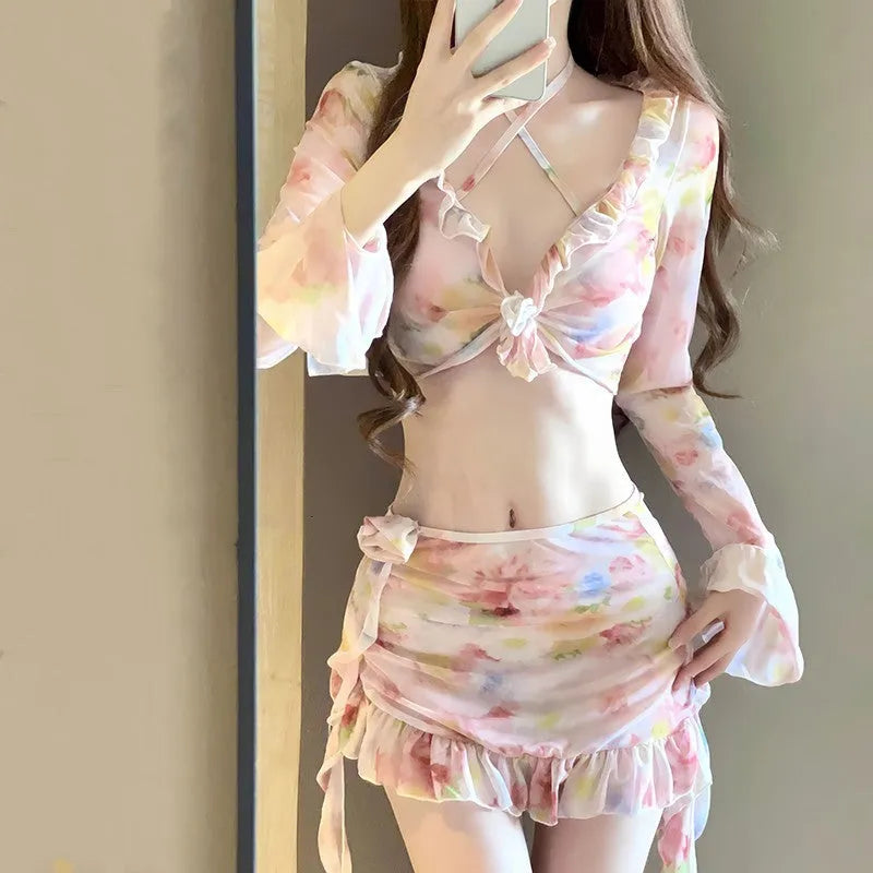 Women's cherry blossom pink floral bikini swimsuit on a mannequin