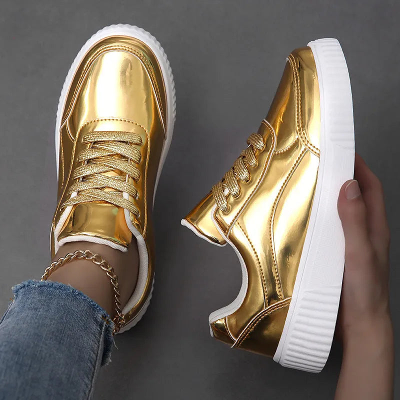 Gold sequin platform sneakers with a round toe and 3-5cm mid heel on a white background