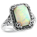 Silver alloy geometric ring with inlaid opal stone on a white background
