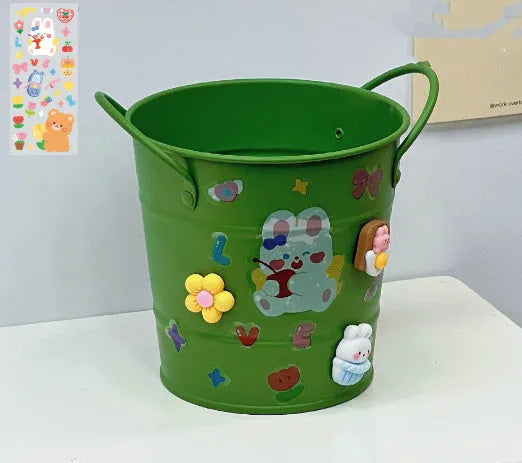 Round metal desktop pen holder storage box in a choice of colours including pink, green, red, white, and yellow.