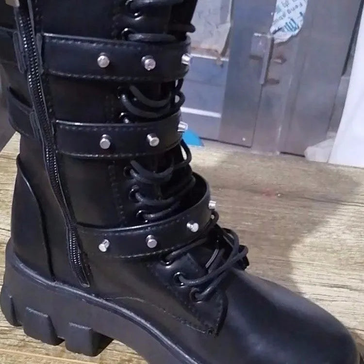 Black women's mid-calf boots with metal buckles and a side zipper on a white background.