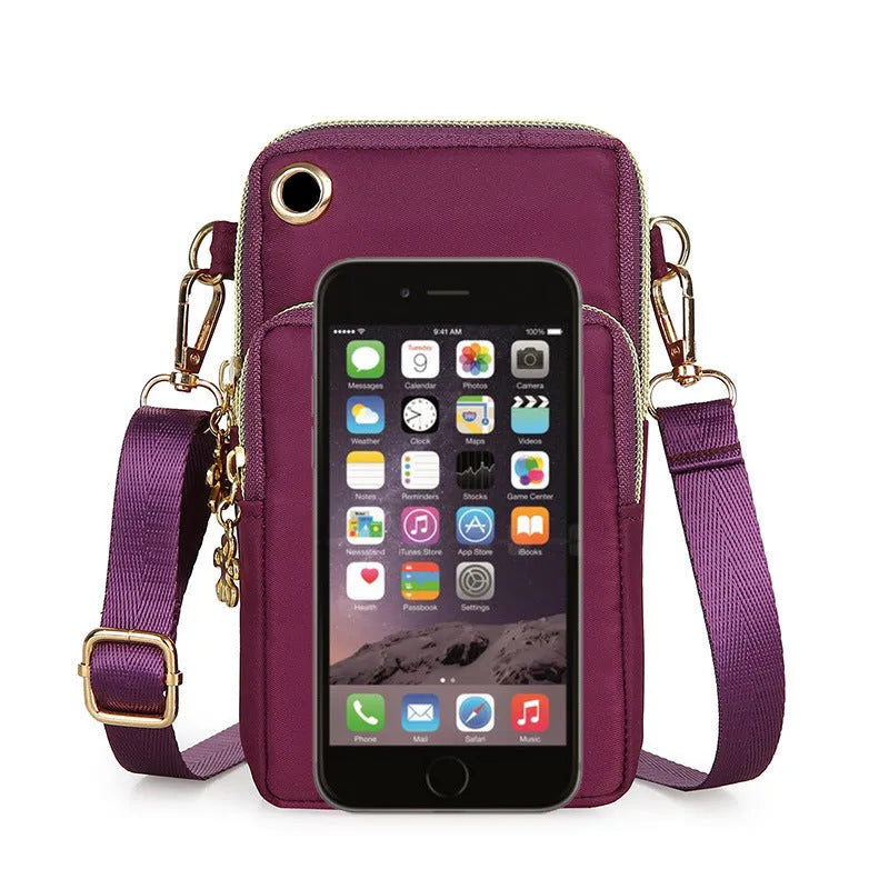 Nylon crossbody mobile phone bag with three zippered layers, card slots, and an adjustable strap in black