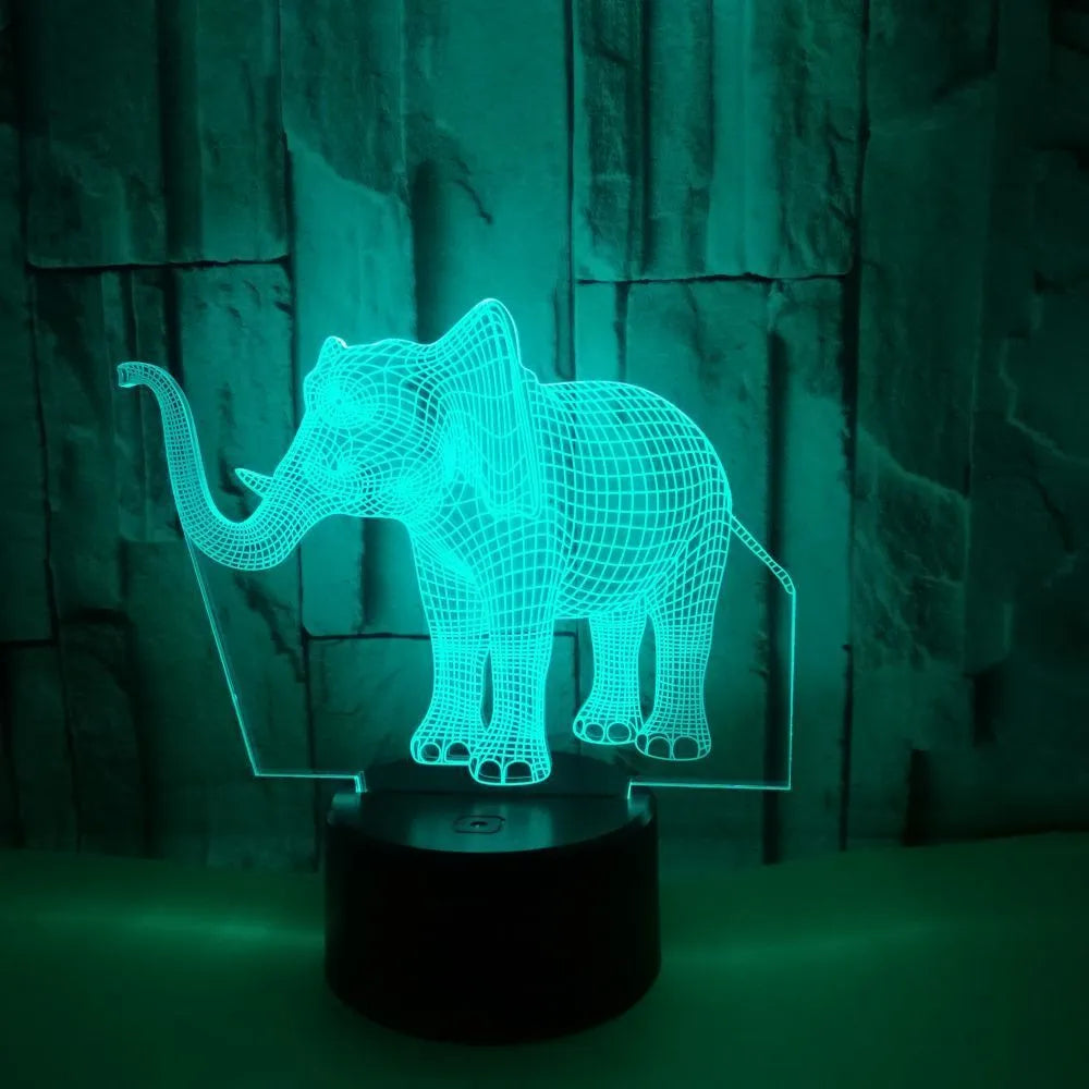 3D elephant-shaped acrylic desk lamp with seven colour modes, USB-powered, on a desk surface