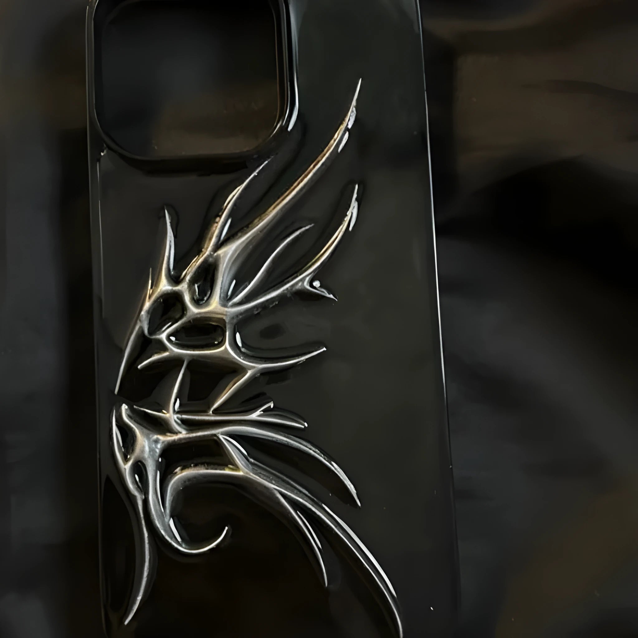 Black iPhone case with three-dimensional blooming wings design for anti-drop protection