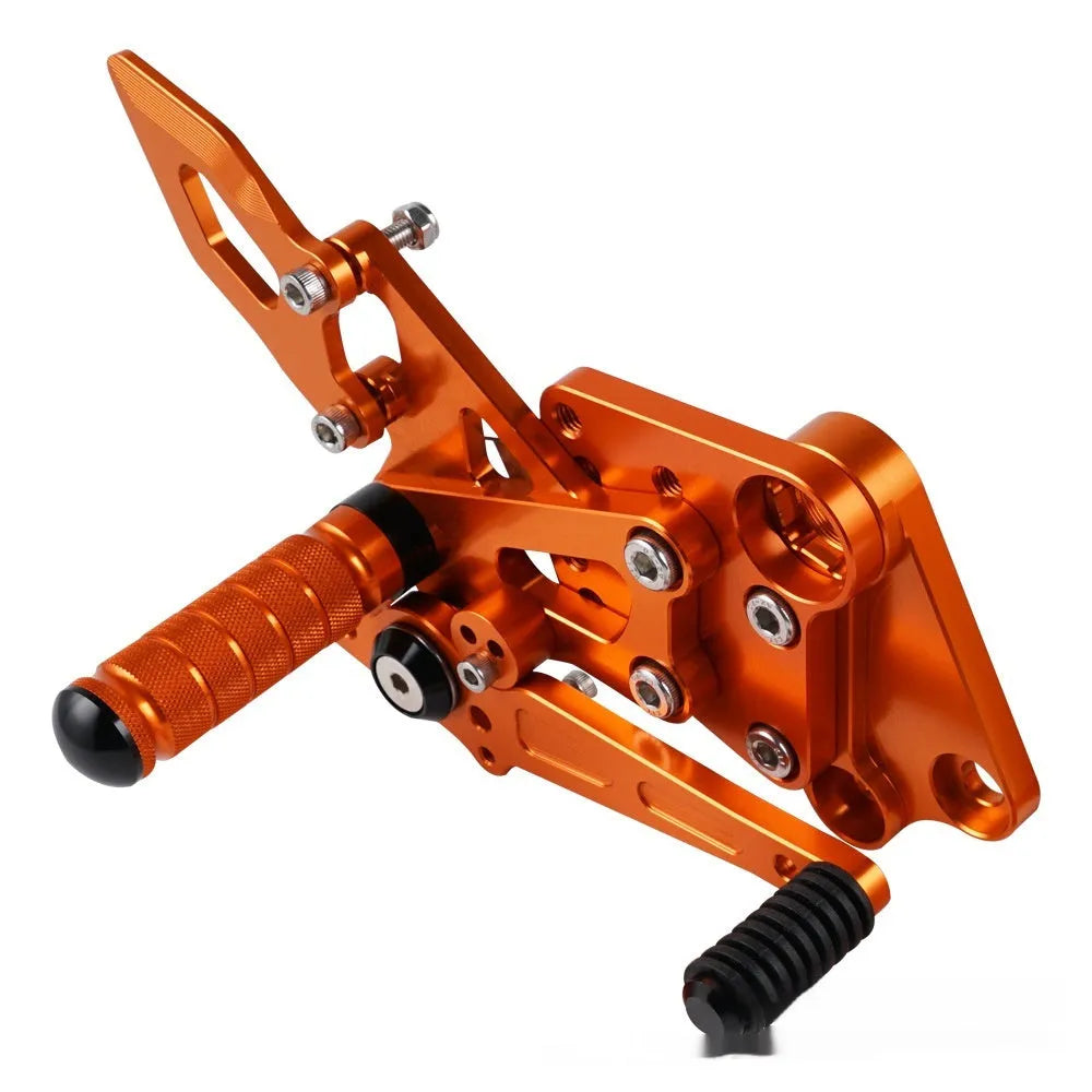 KTM DUKE motorcycle raised rear shift pedal support bracket assembly in black and orange