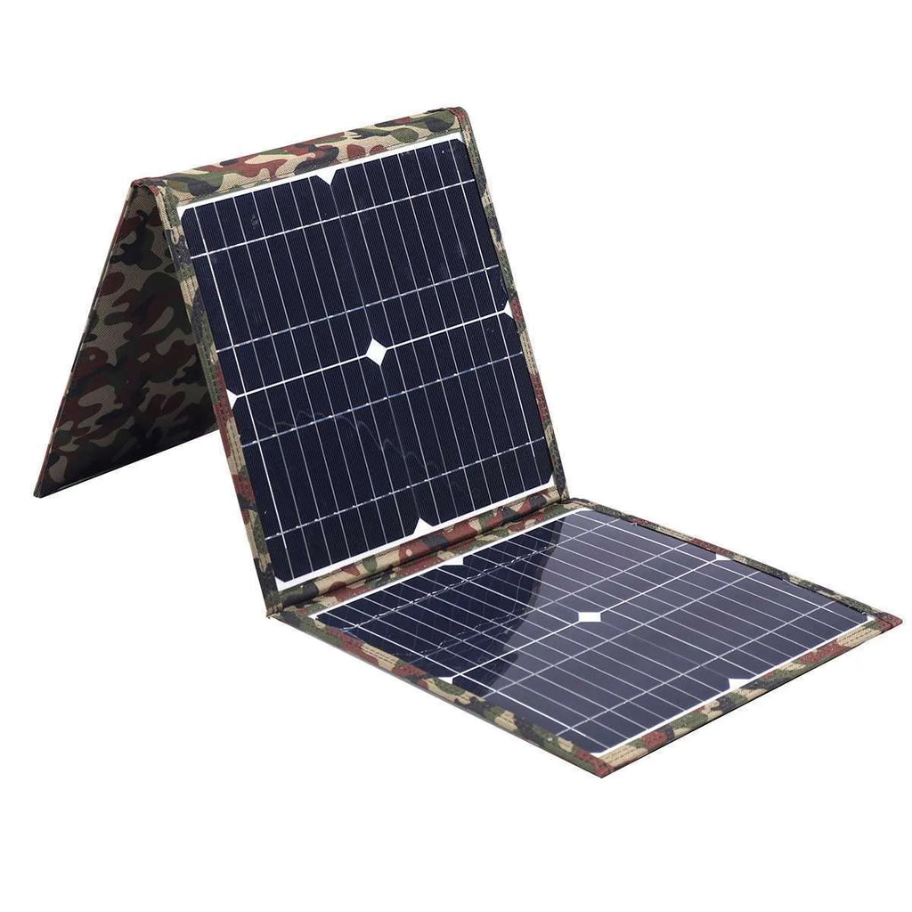 Black foldable 36W solar panel unfolded showing three monocrystalline silicon cells with charging accessories