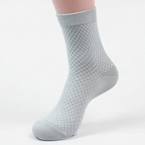 Men's bamboo fibre socks in black, navy, silver, iron grey, and grey blue with small square pattern.