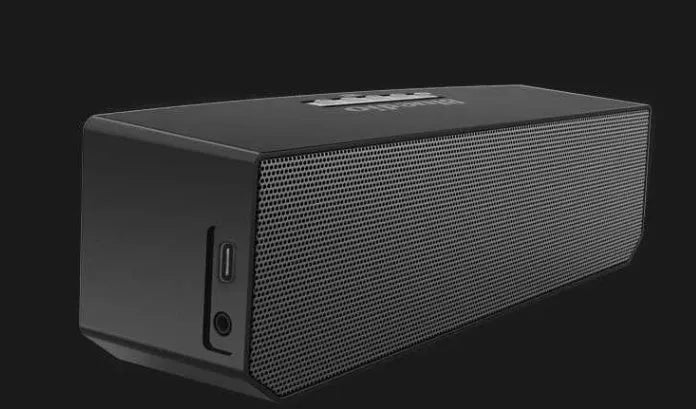 Black cloud smart speaker with compact design and micro-USB port.