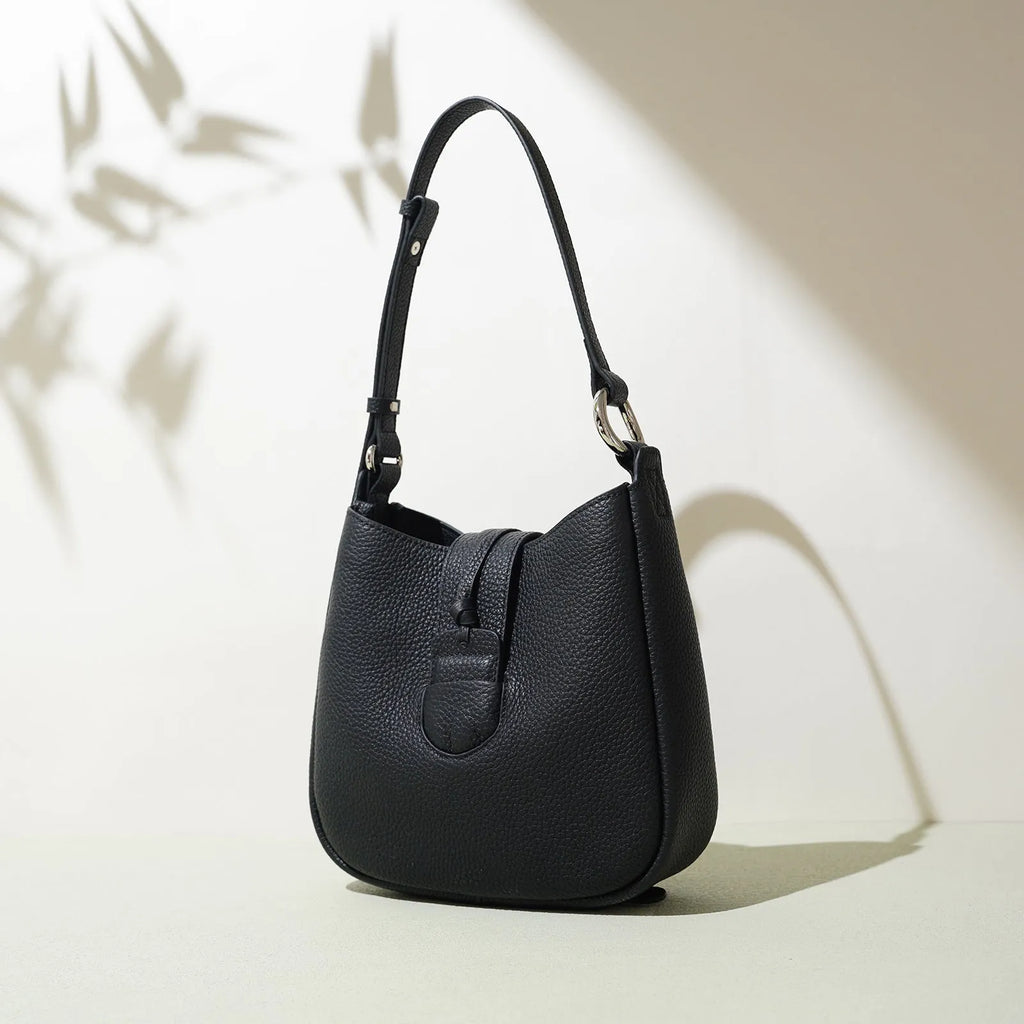 Large capacity commuter soft leather crossbody bag in bucket shape with sewing line details