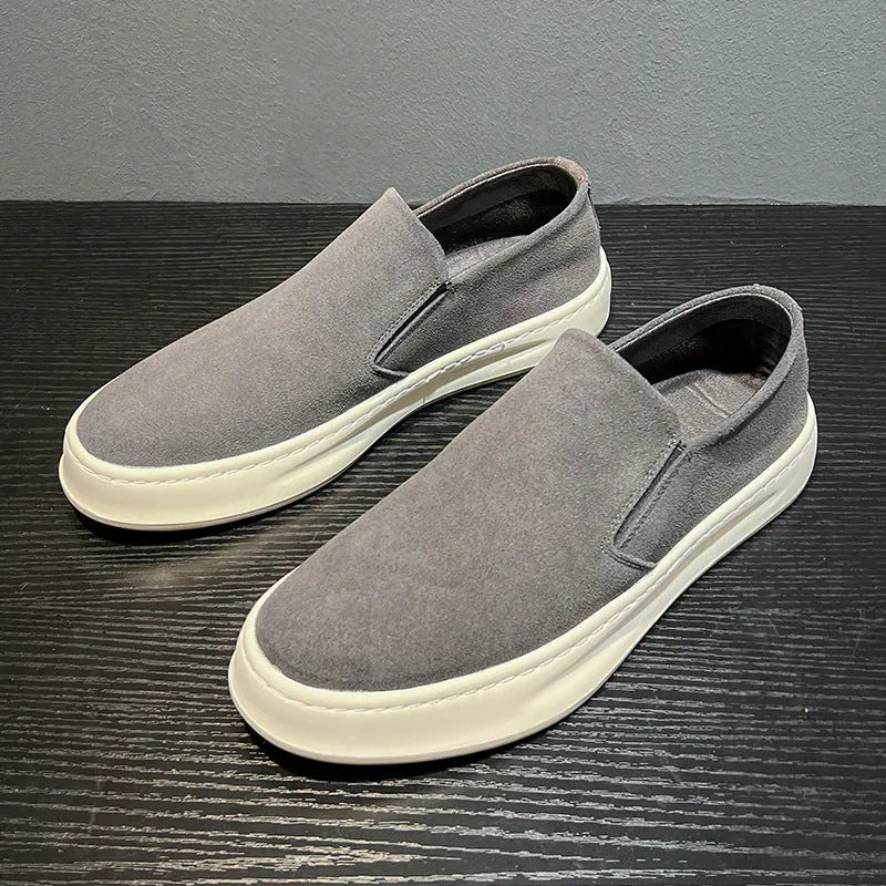 Gray men's casual slip-on shoes with round toe and mid heel on a white background