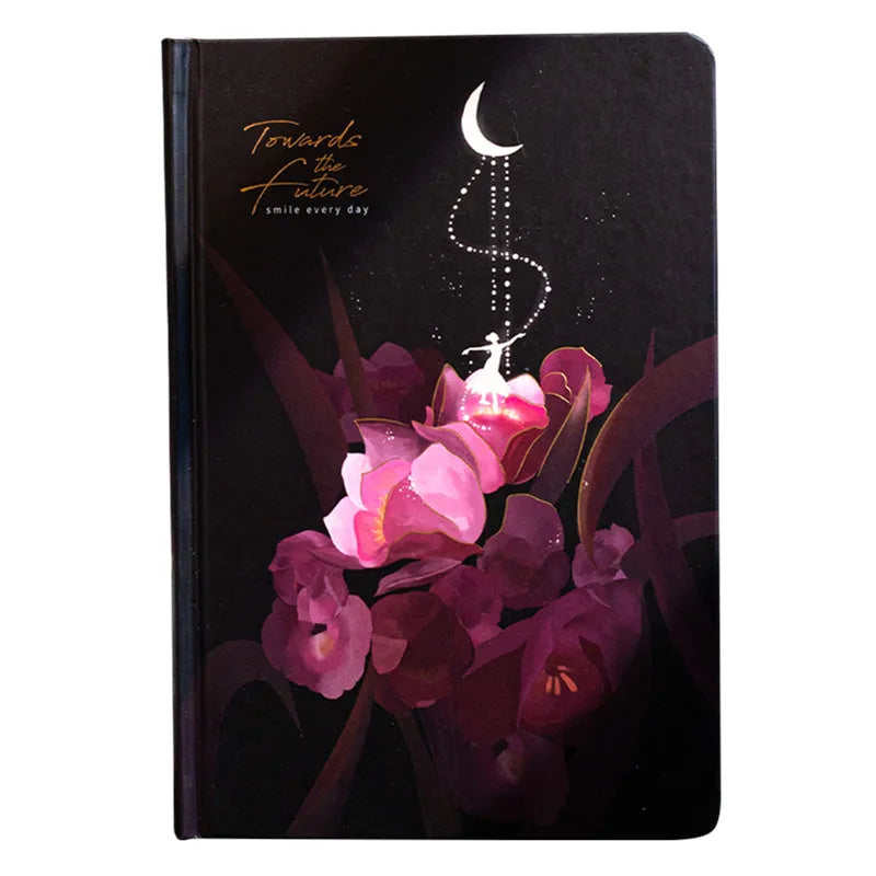 A5 spiral-bound notebook with a luminous coloured cover, open to show lined pages with colour illustrations.