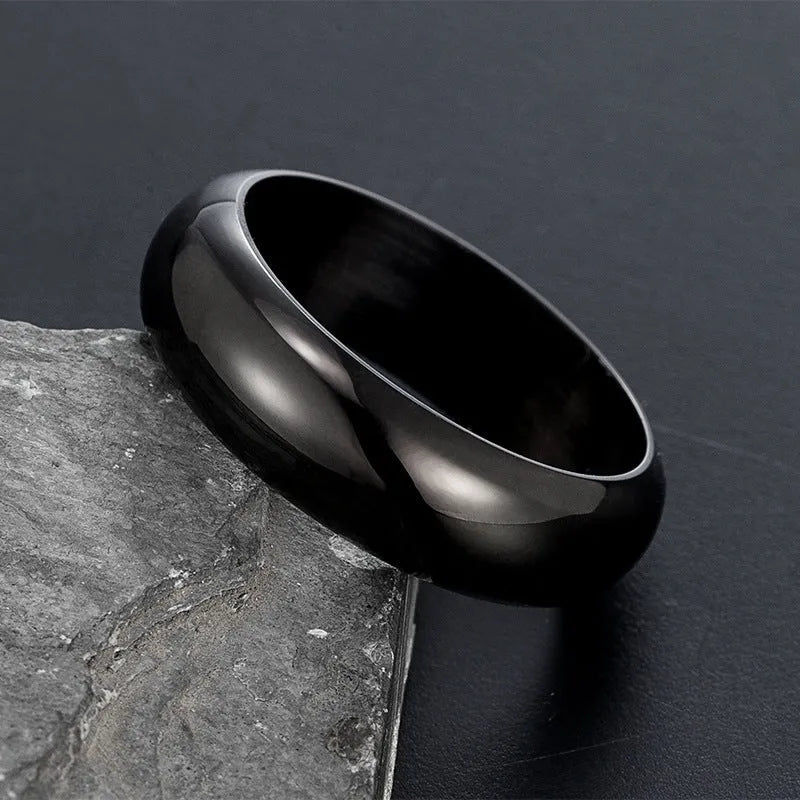 Glossy electroplated titanium steel ring shown in gold, black, and steel colour on a plain background.