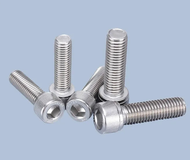 Stainless steel cartridge mounting screw set with allen bolts, nuts, washers, and two allen keys on a grey background.