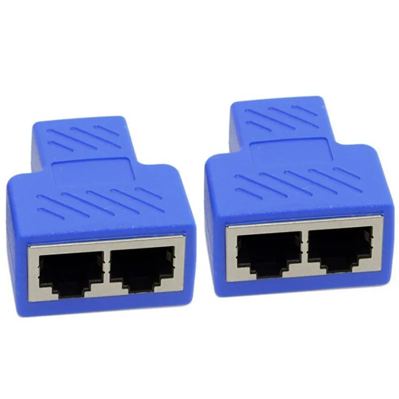 Two white RJ45 three-way tee network cable splitters on a dark surface.