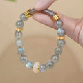 Gray moonstone women's half bracelet with 8mm round beads on wrist