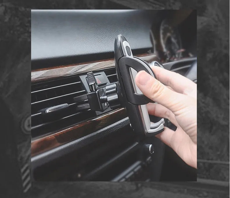 Black universal car mobile phone holder mounted on air conditioning vent