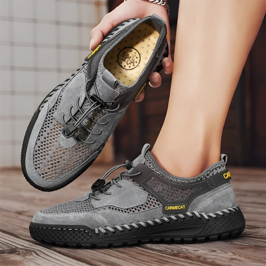Men's brown suede casual shoes with elastic band closure and hand-stitched sole.