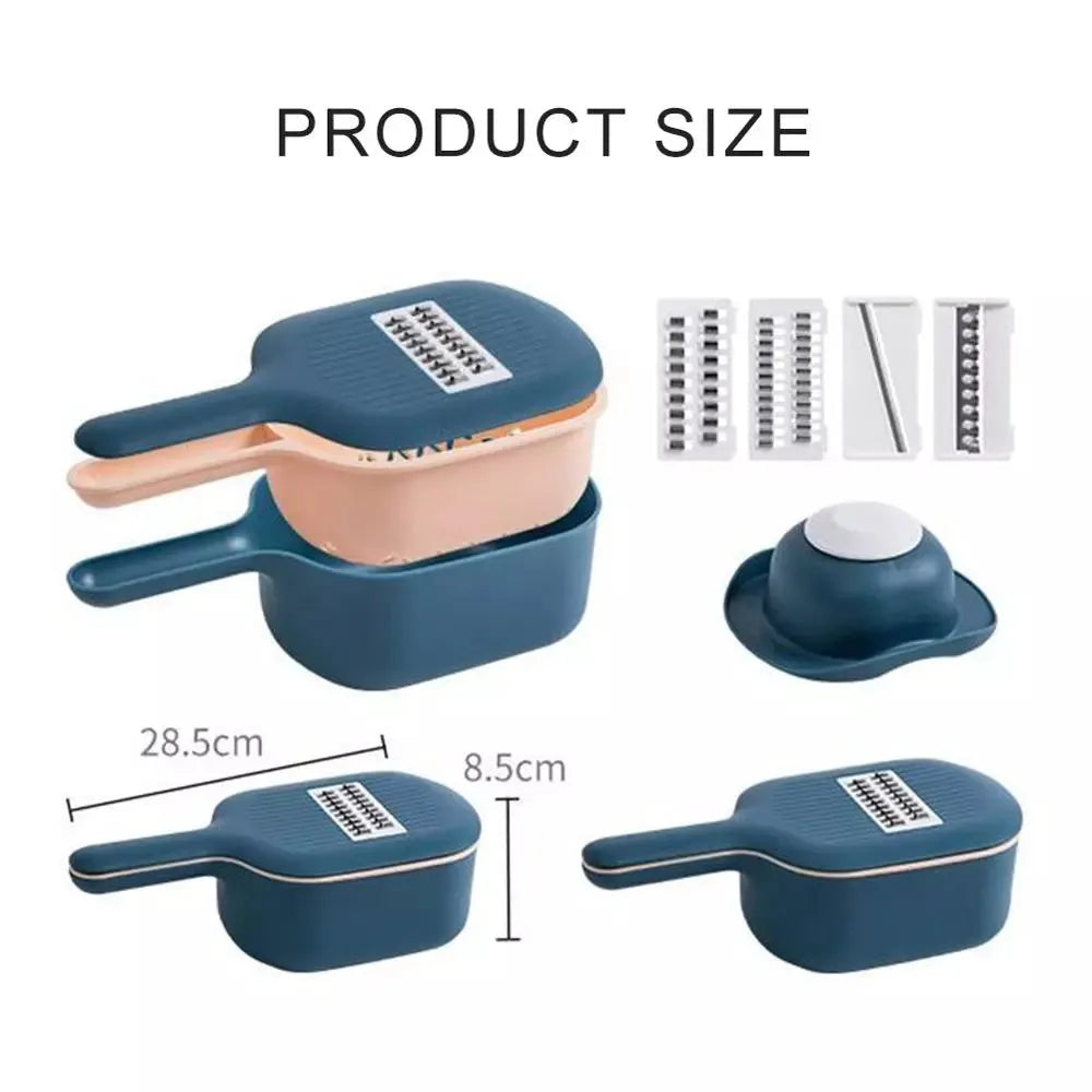 Dark blue manual vegetable cutter with four blades, hand guard, and drain basket on a kitchen counter