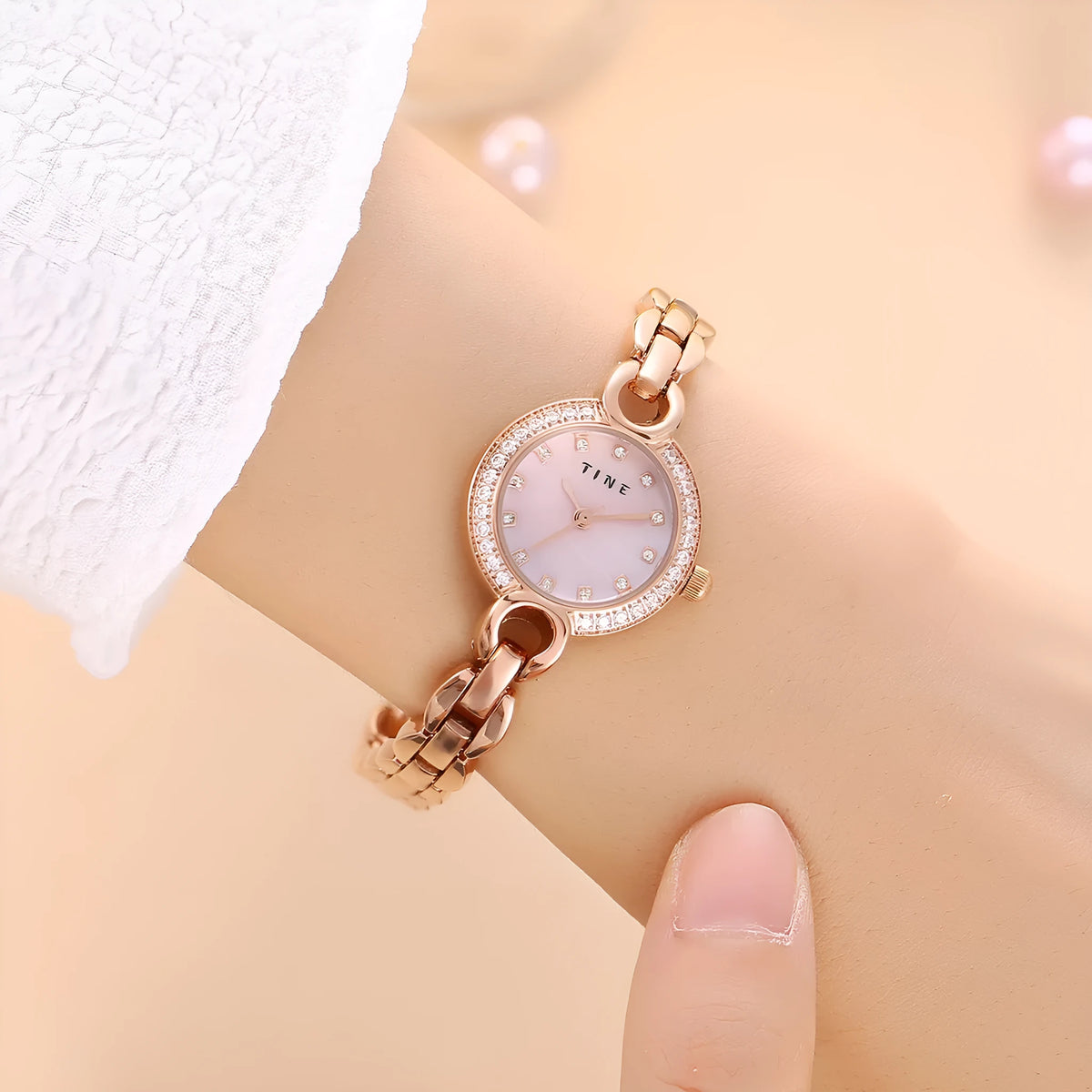 Women's fashion bracelet watch with alloy band, stainless steel buckle, 23mm case, and round or square dial.