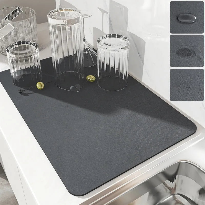 Square kitchen drain pad mat with black PU leather surface showing liquid absorption and rubber anti-slip backing