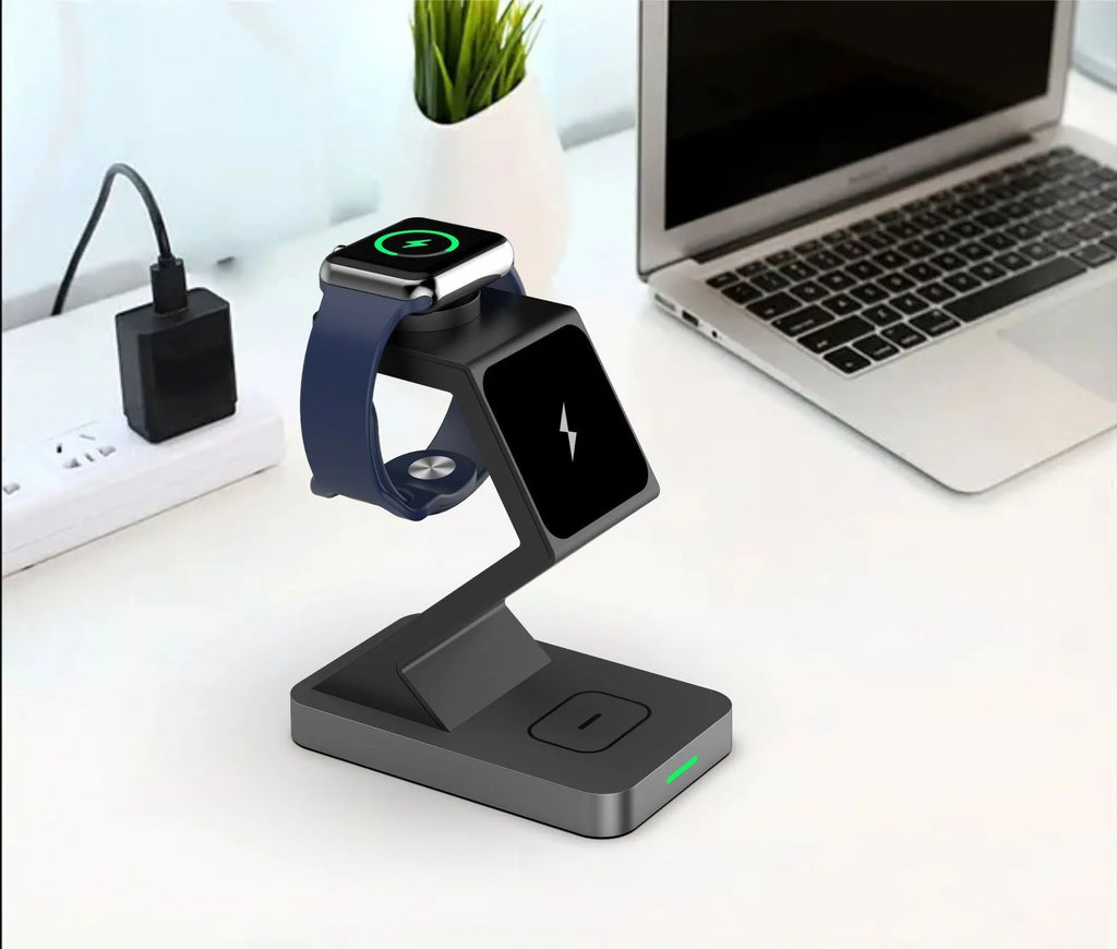 Three-in-one magnetic wireless charger phone holder in black with phone, watch and earbuds on a desktop