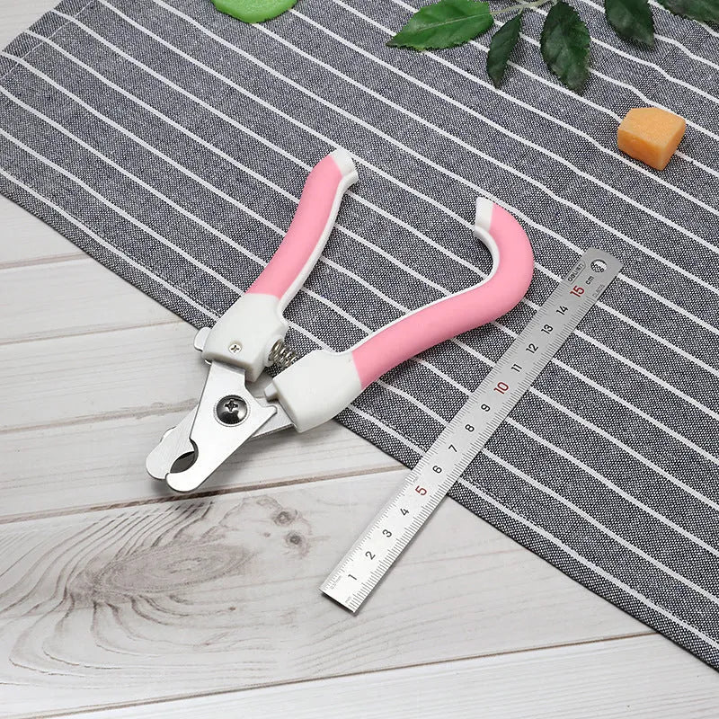 Pet nail scissors with stainless steel cutter head and curved handle in blue or pink, small or large, for dogs and cats