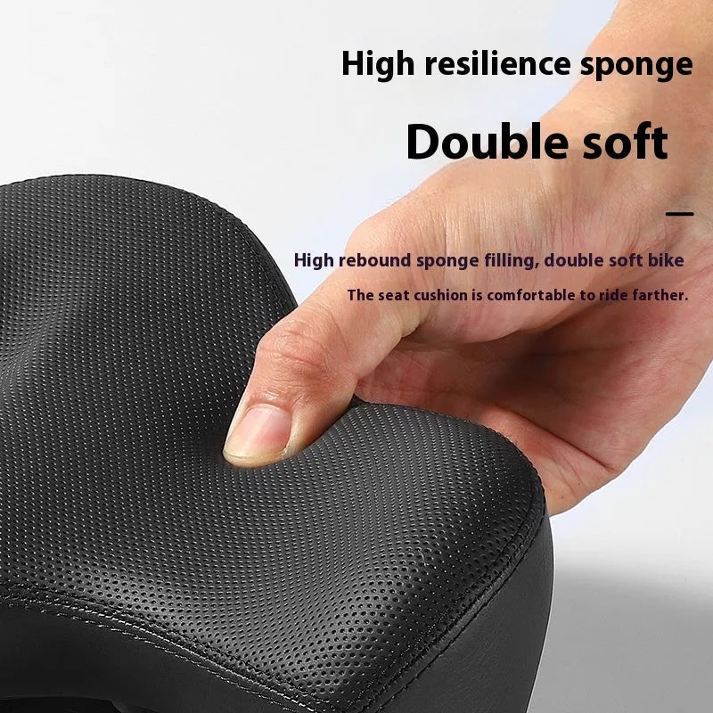 Black thick foam bicycle seat cushion on a mountain bike saddle.