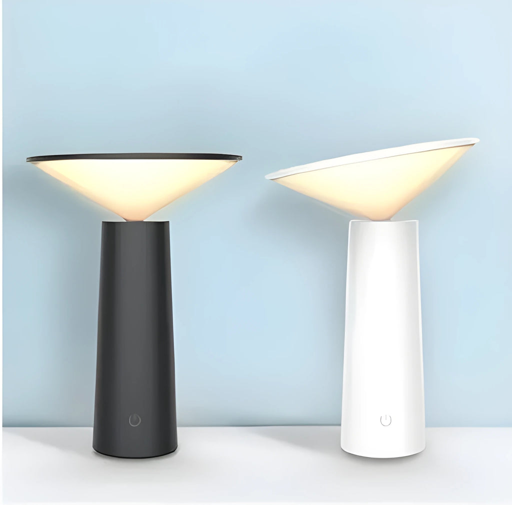Black USB rechargeable desk lamp with touch sensor base and a tilted lamp head on a wooden desk.