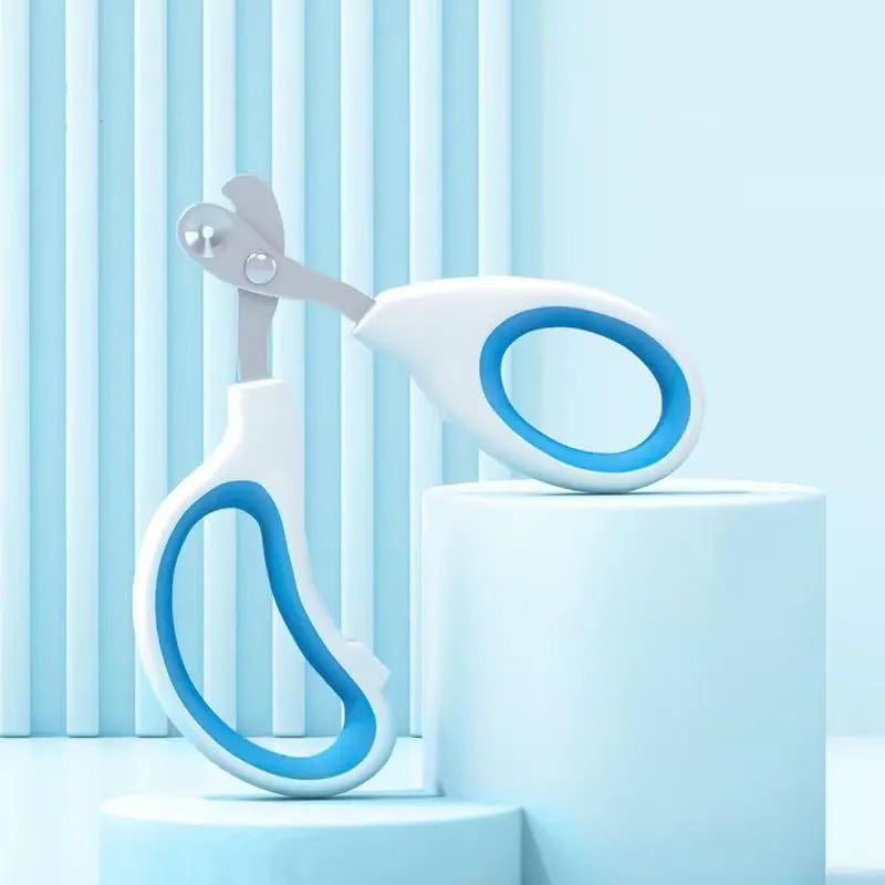 Blue pet nail clippers with a circular safety hole and non-slip handle on a white background.