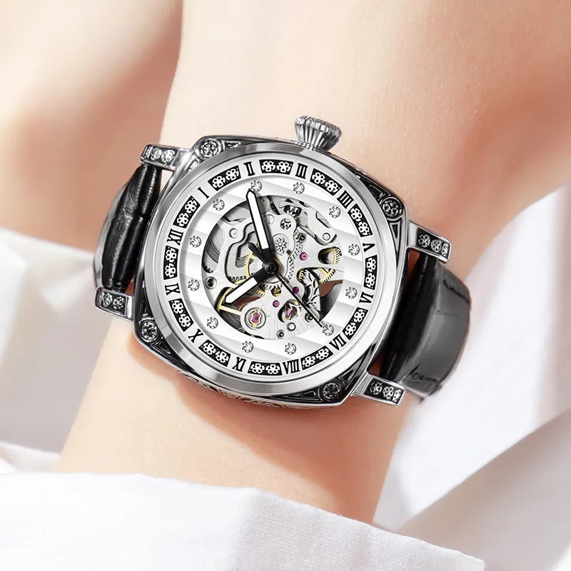 Men's black mechanical watch with luminous hands on a leather strap, showing water resistance.