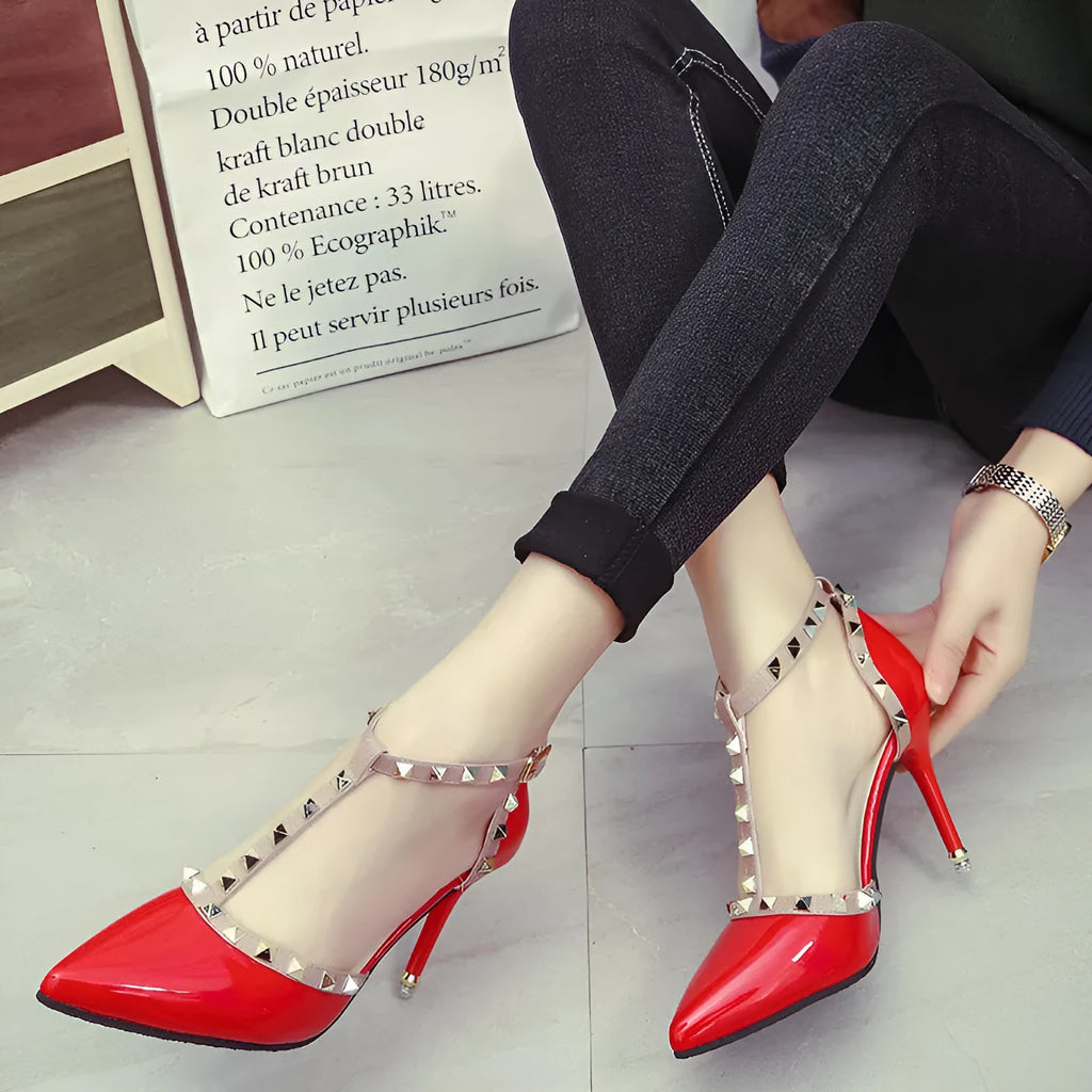 Studded pointed high heels with stiletto heel and buckle fastening in black