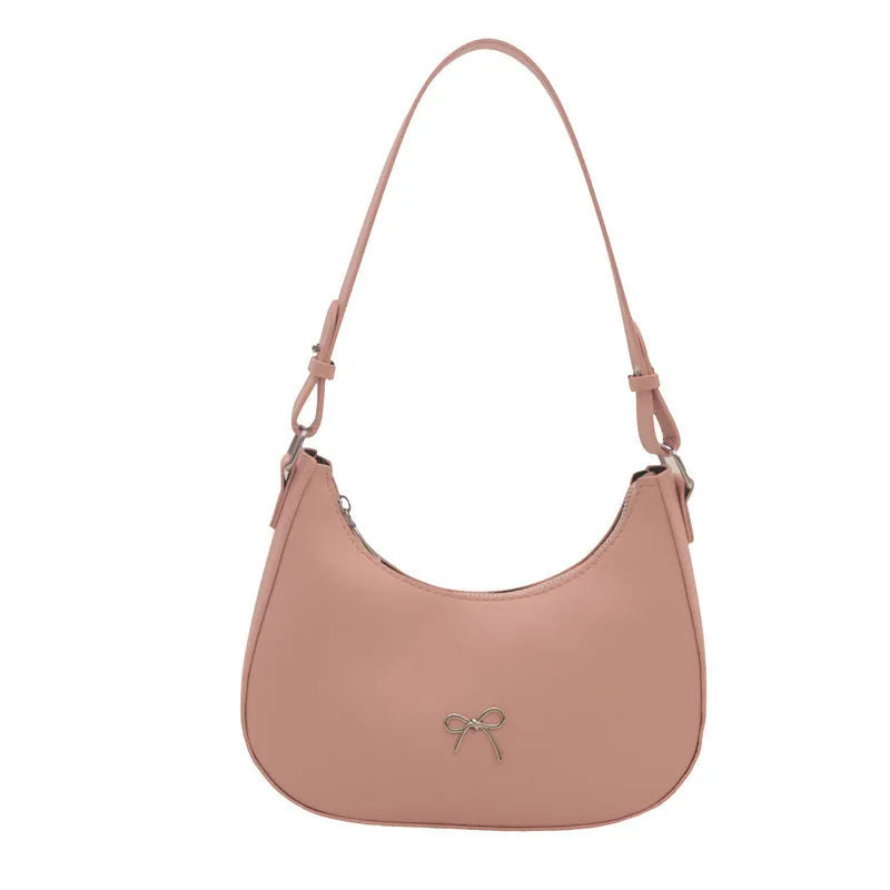 Women's underarm small shoulder bag in dumpling shape, shown in one of six colours: white, black, pink, khaki, brown, or silver.