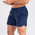 Men's knee-length training shorts with elastic waist in black, dark grey, navy blue or white