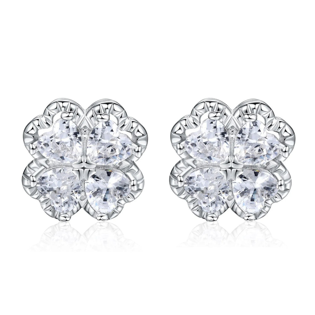 A pair of 925 silver earrings with a heart and four-leaf clover design, set with zircon stones in a white gold colour finish.