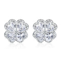 A pair of 925 silver earrings with a heart and four-leaf clover design, set with zircon stones in a white gold colour finish.