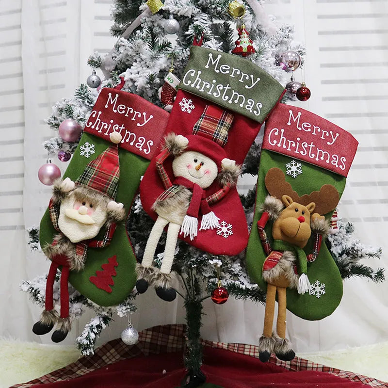 Three large Christmas stockings with 3D Santa, Snowman, and Reindeer designs hanging from loops