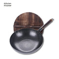 Traditional black iron wok with wooden handle, 40cm diameter, showing induction-compatible flat base