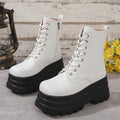 Women's black retro platform Martin boots with chunky heel and side zipper on a three-layer sole