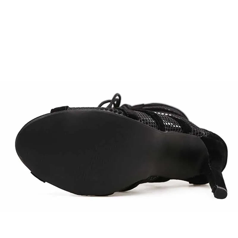 Black suede women's lace-up high heel shoes with an 11.5cm heel on a plain background